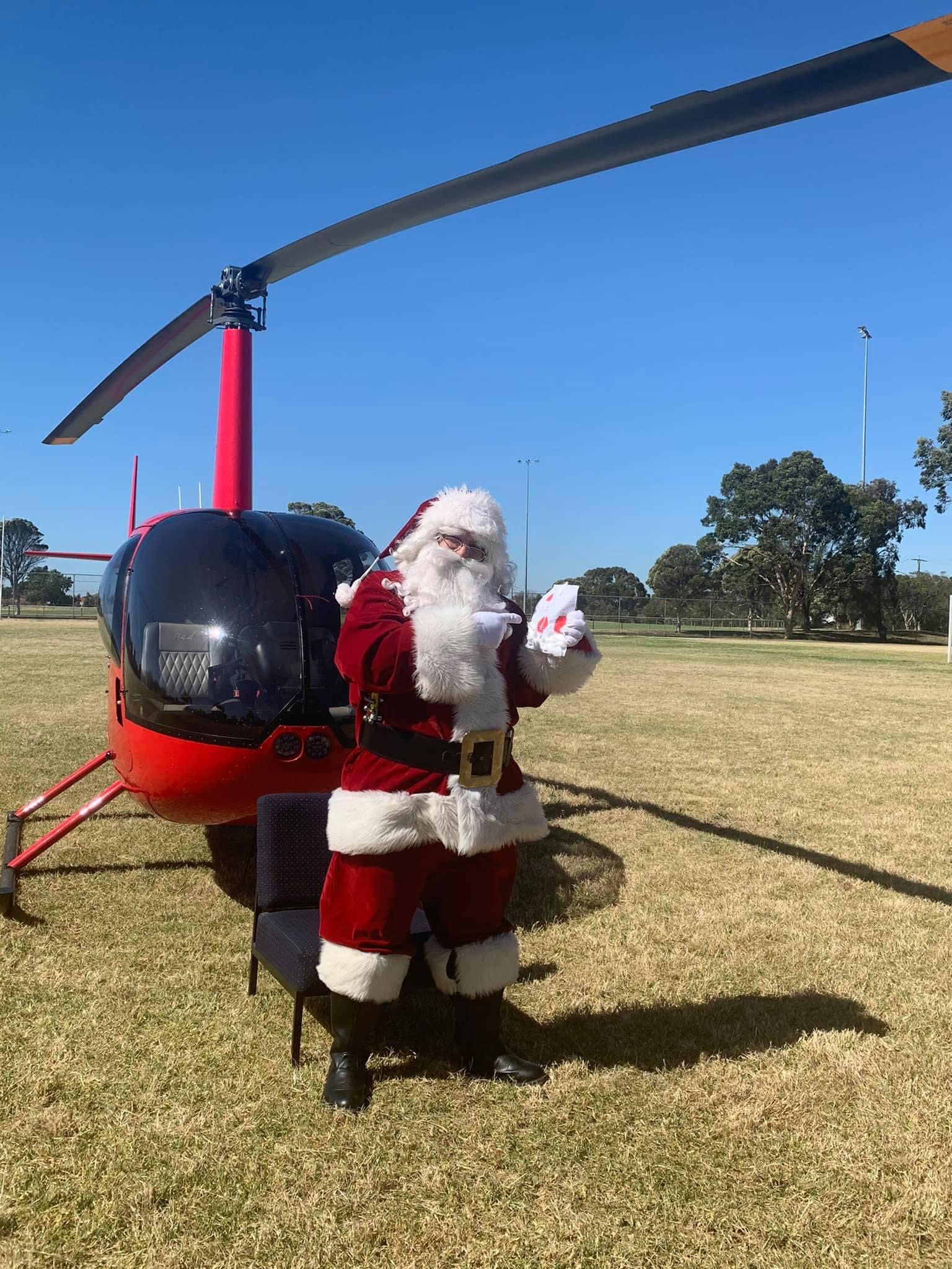 Santa Photos, fly with Santa, family photos, Heli tours melbourne, red helicopter melbourne
